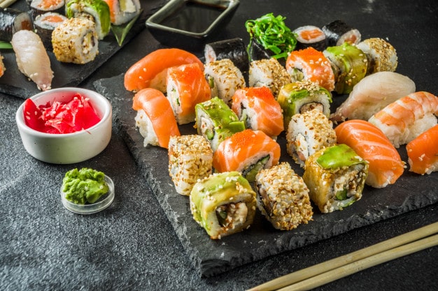 How is sushi served on the table?